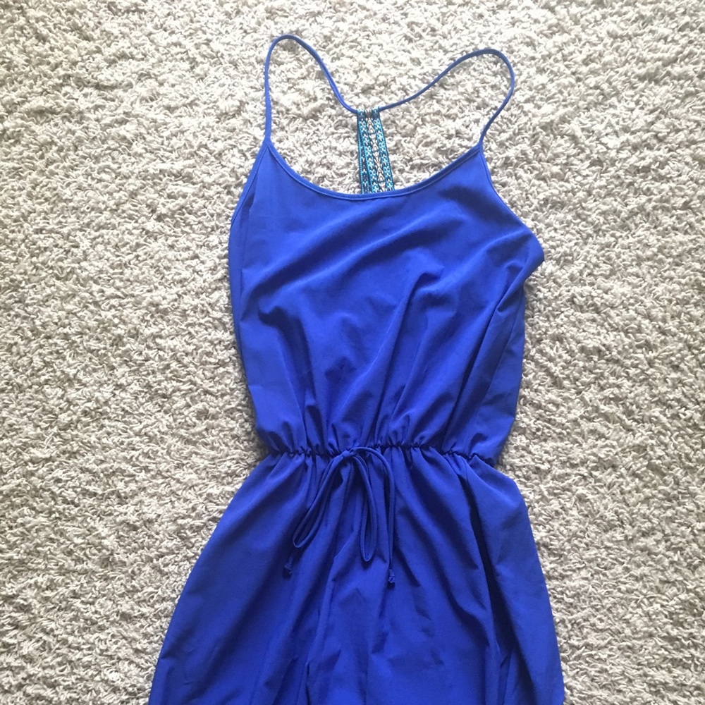 Blue jumpsuit with criss-cross back straps